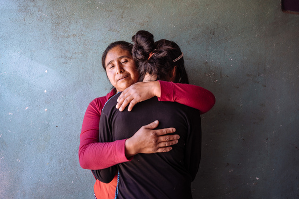 Irma Adelaida Carrillo Ramos, from Paraje Tres Cruces, Malacatancito, Guatemala, shares her story of resilience and hope amidst the challenges of rural life. Living far from the city, Irma’s community struggles with limited access to essential services and economic opportunities. "Living here is very far from the center of town. It's about 10 to 20 minutes by car, but there are no public buses, so if you don't have a car, you have to walk," Irma explains. The isolation makes everyday tasks difficult, especially for those without personal transportation. Irma’s family relies heavily on external support to make ends meet. "The scholarships and food supplies we received helped us a lot. The bus used to pick up the children for school, which was a big help. The food supplies saved us money that we could use for other necessities," she shares. The discontinuation of these aids has had a significant impact. "I thought the support would continue, but they told us it would stop this year, which affects us because it was a monthly help." Economic opportunities in the area are scarce, exacerbated by the harsh environment. "The land here is very dry. There’s no water, and we suffer a lot during the dry season. We have to go to a river an hour away to wash clothes, and carrying the water back is very hard," Irma says. The limited resources force many community members, including her daughters, to work in the local landfill, recycling materials to sell. "It's a very difficult job. My daughters work there every 15 days, but the heat and the smell make it tough, and they often come home with headaches and skin issues." Irma also discusses the social and emotional toll of migration. "Many people have left to find work abroad, but it's risky. Some never come back, leaving their families behind. It's hard for mothers to see their children go, not knowing if they’ll return or how long they’ll be away," she laments. Her son, currently studying mechanics and pastry making, dreams of migrating to seek better opportunities, but Irma fears for his safety. "I told my son to stay and fight for a future here because the journey is too dangerous," she says. Irma emphasizes the importance of education in breaking the cycle of poverty. "Education is very important. It can help my children find better jobs and not have to suffer in the landfill." Despite the hardships, Irma remains hopeful for continued support. "The scholarships and food supplies were a great help, especially when my son had legal issues. The support allowed him to continue his studies and avoid going to jail," she explains, highlighting the crucial role of external aid in their lives.