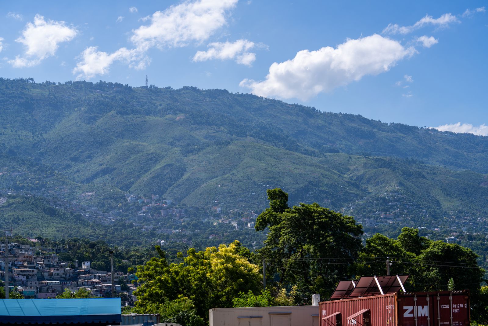 Stark Contrast between Beauty of Nature and Gang Violence as Experienced by IDP Community in Haiti 