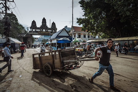 Dozens of Cambodians commute through the Thai border in Poipet. For many, they work daily in nearby border towns while others might venture further in to work for short to long term periods.