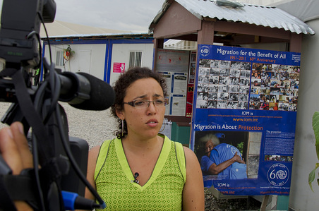 IOM staff being interviewed in Haiti by local media.