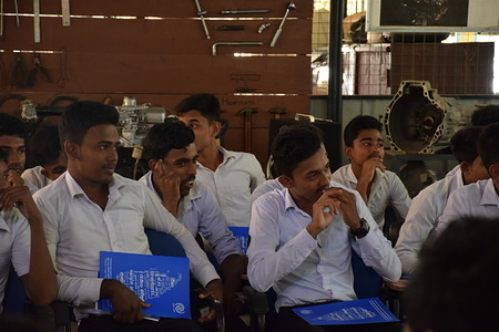 Students with the dockets containing the safe migration information during the safe migration awareness session for the vocational institute students. These students enter the local and foreign job markets after the completion of their vocational courses and industrial placement which make them to opt for migration options.
