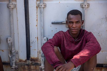 A young migrant in IOM's Migration Response Centre in Obock, Djibouti, where he is staying as he waits for IOM to organize his voluntary return home.

Thousands of migrants from the Horn of Africa travel through Djibouti on their way towards Yemen, usually hoping to reach Saudi Arabia.