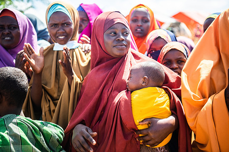 Women IDPs in Marka Town, Lower Shabelle Region listen during community discussion with different UN organizations, IDP