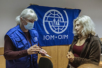 IOM staff carry out cash-based intervention activities to Ukrainian refugees in Chisinau, Moldova. IOM staff distribute cash vouchers which are valid at local supermarkets in order to purchase essentials for refugees.