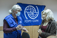 IOM staff carry out cash-based intervention activities to Ukrainian refugees in Chisinau, Moldova. IOM staff distribute cash vouchers which are valid at local supermarkets in order to purchase essentials for refugees.