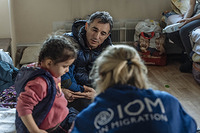 IOM staff carry out medical assistance and fit-to-travel checks for Azeri TCNs in Chisinau, Moldova. The group of TCNs had recently arrived from Ukraine and organized onward bus transportation to Azerbaijan.