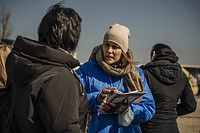 IOM staff members conduct DTM surveys to recent Ukrainian refugee arrivals at Palanca, Moldova.