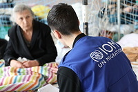 IOM staff assesses the needs of vulnerable people at a displacement center in Uzhhorod. Elderly people are among the most vulnerable populations with special needs.