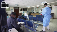 Medical staff assiting patients on a line queue. IOM Kenya conducts health assessments for prospective migrants to the United States of America, Australia, Canada, New Zealand, United Kingdom among other countries at the Migration Health Assessment (MHAC).