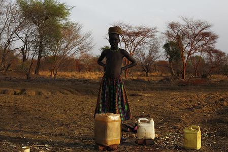 MSD0294
Dinka girl by a puddle where she filled up her jerry cans with unsafe drinking water. Over 500,000 people continue to lack access to improved drinking water in Northern Bahr el Ghazal state. (Malual East payam)